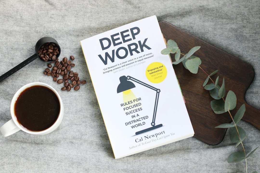 Research books and notes representing an AI deep research workflow for source-backed blog posts