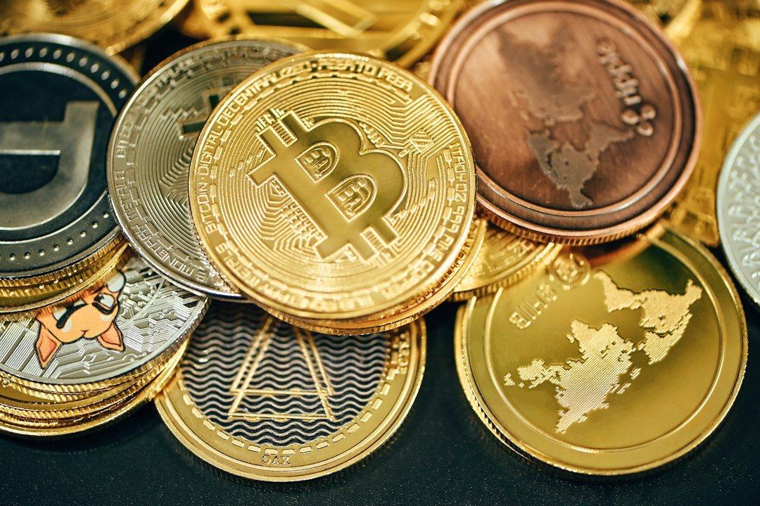 Physical Bitcoin and cryptocurrency display coins on a dark background